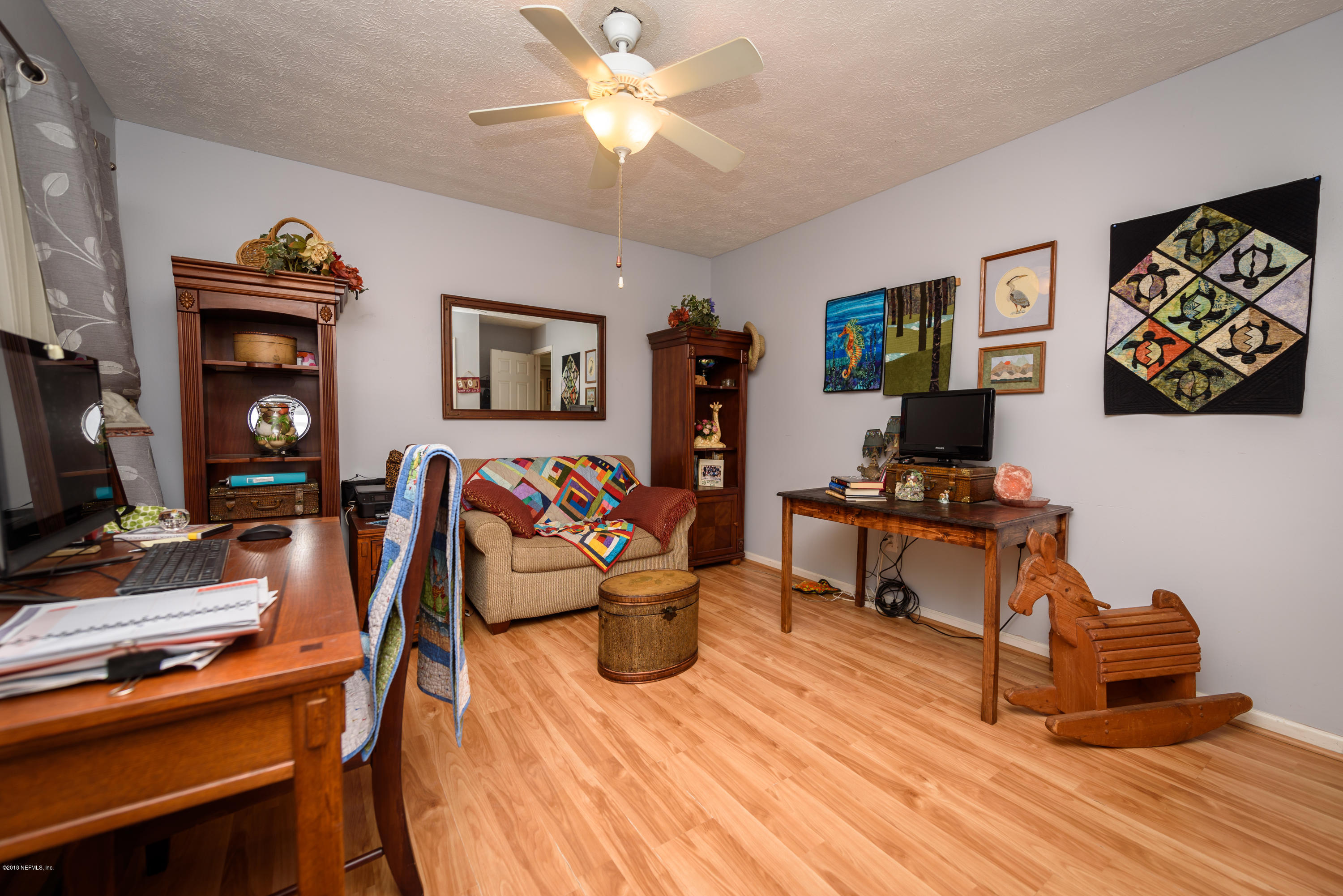 249 Bonita Road St. Augustine, FL 32086 - Photo 25 of 46 a living room with furniture and a flat screen tv