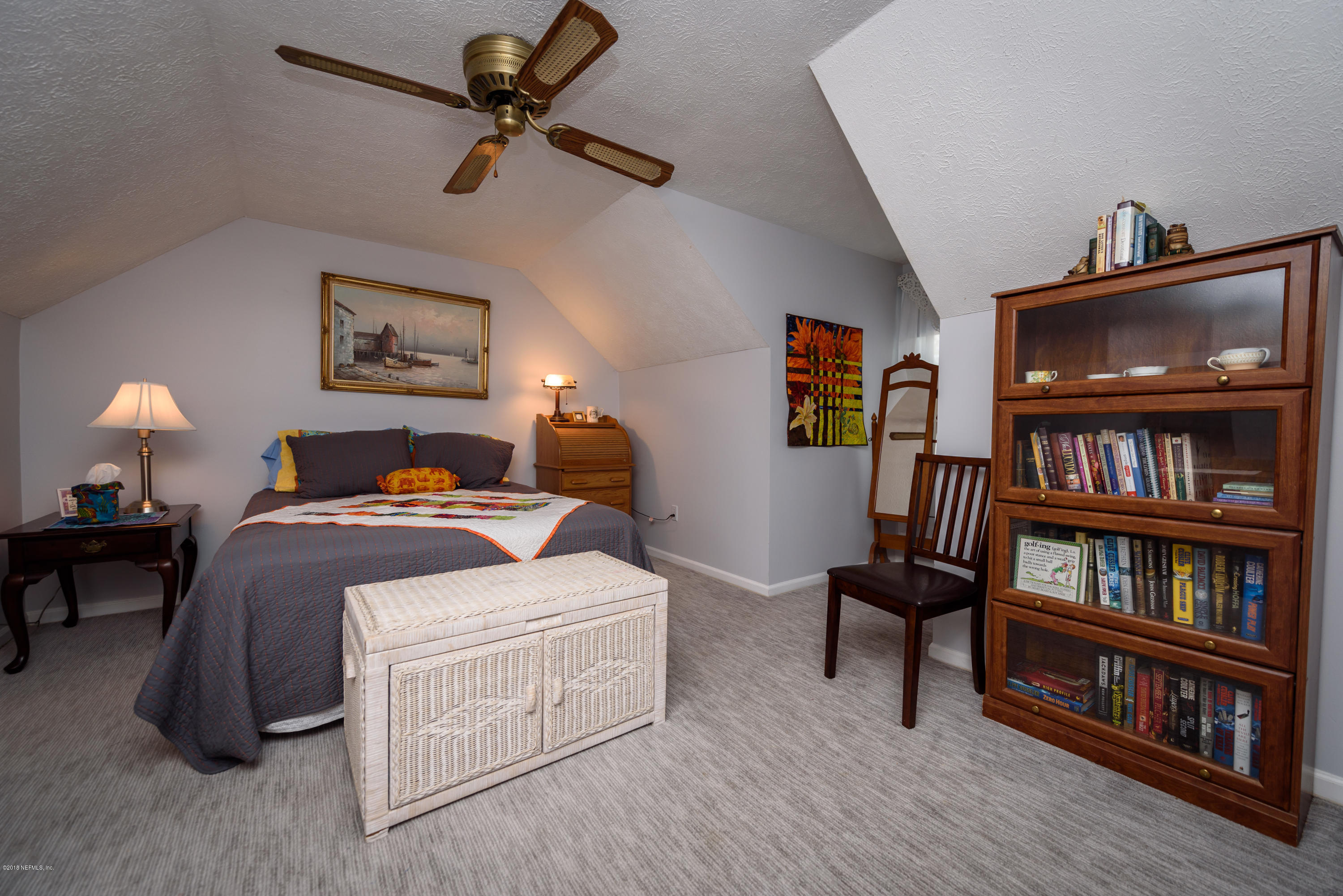 249 Bonita Road St. Augustine, FL 32086 - Photo 27 of 46 a bed room with furniture and a book shelf