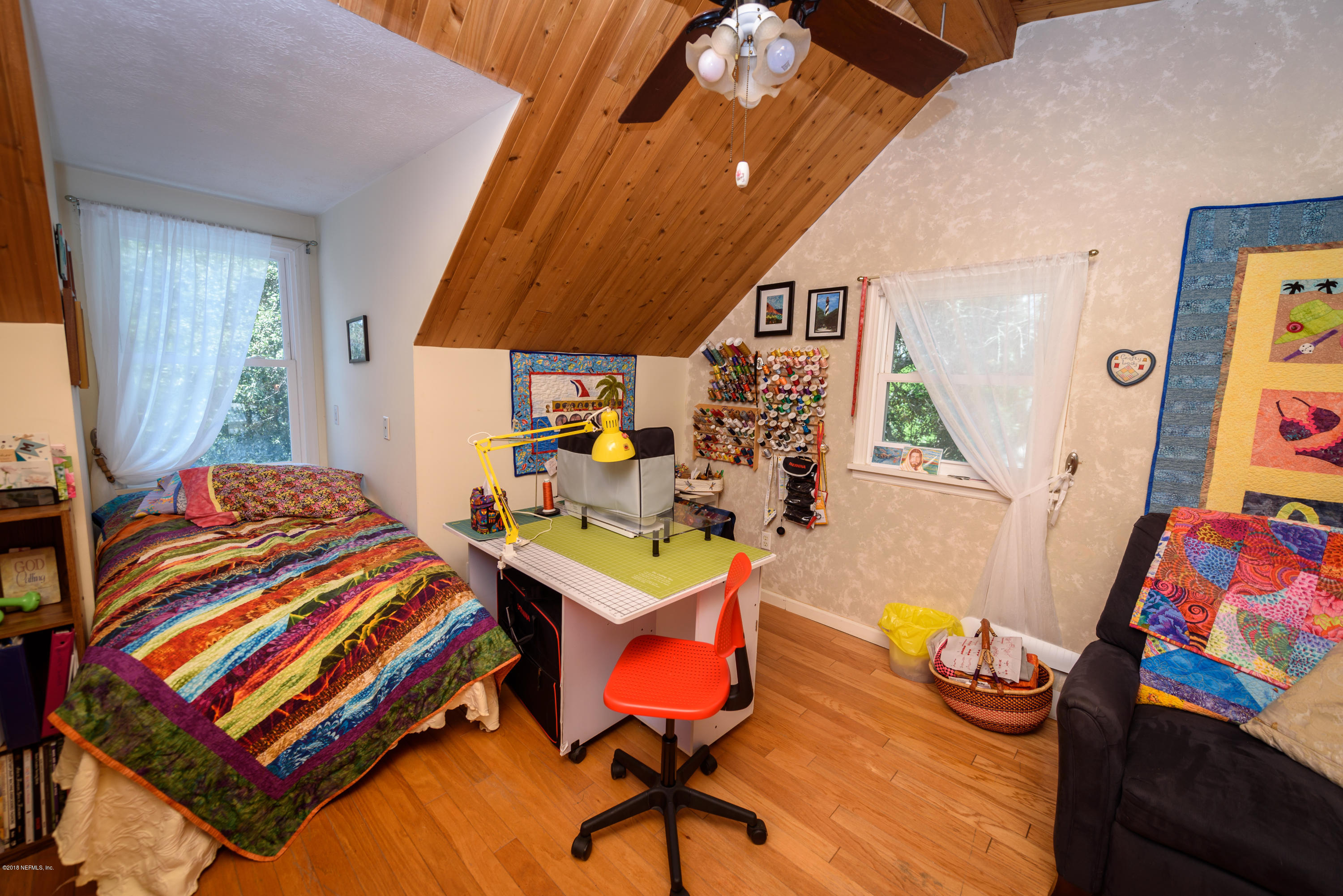 249 Bonita Road St. Augustine, FL 32086 - Photo 30 of 46 a bedroom with a bed and a table in it