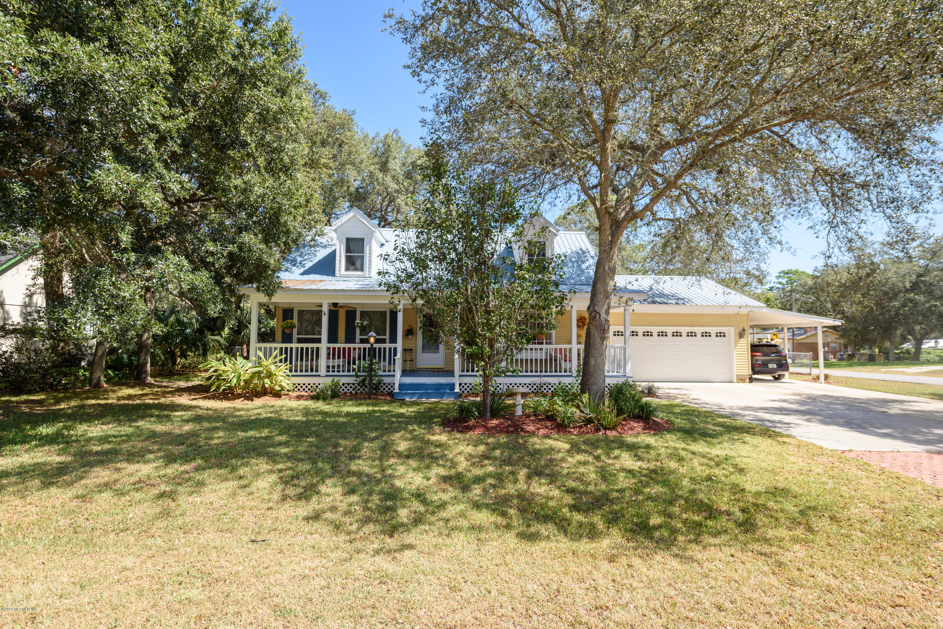 249 Bonita Road St. Augustine, FL 32086 - Photo 3 of 46 a front view of a house with a yard