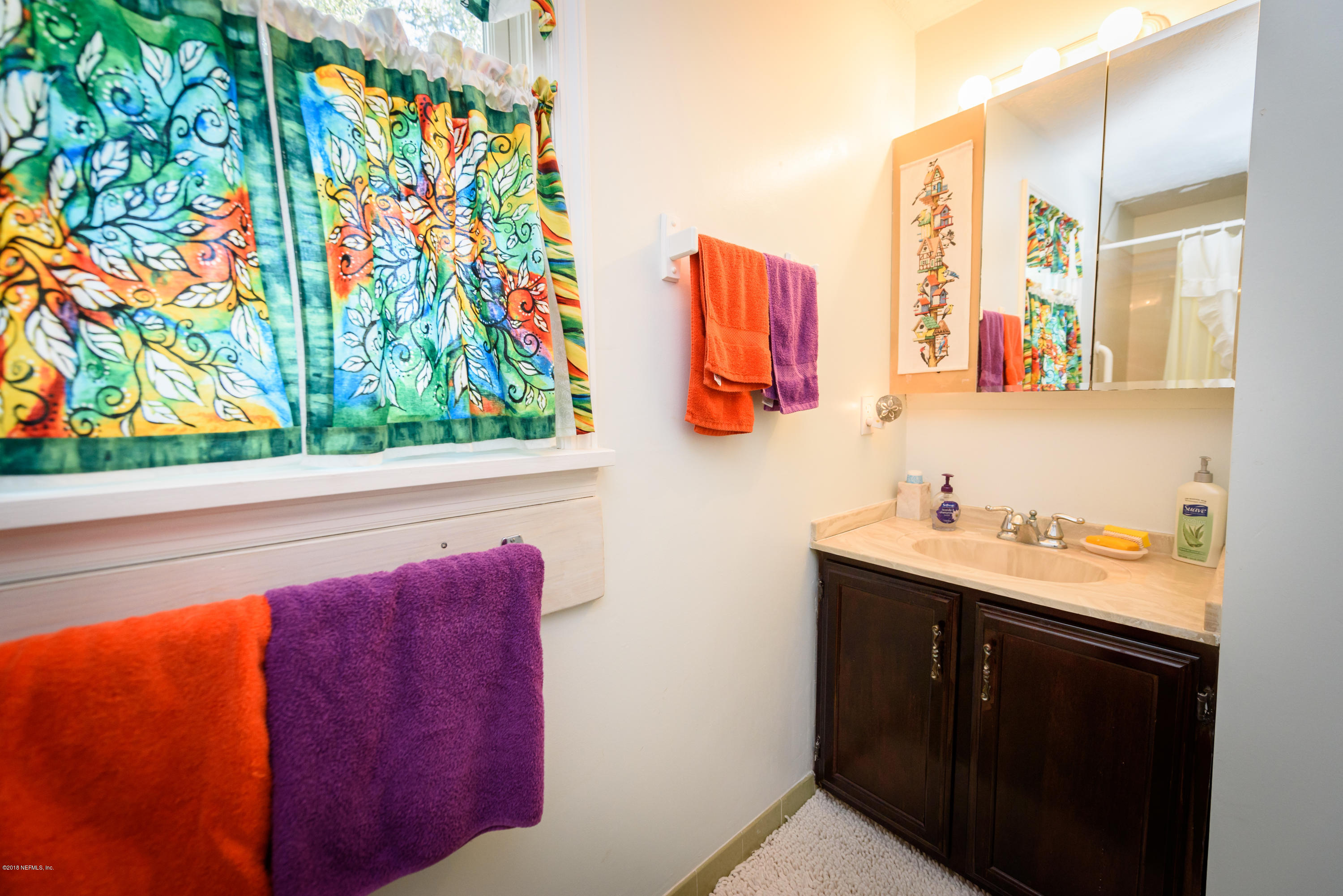 249 Bonita Road St. Augustine, FL 32086 - Photo 32 of 46 a bathroom with a sink and a mirror