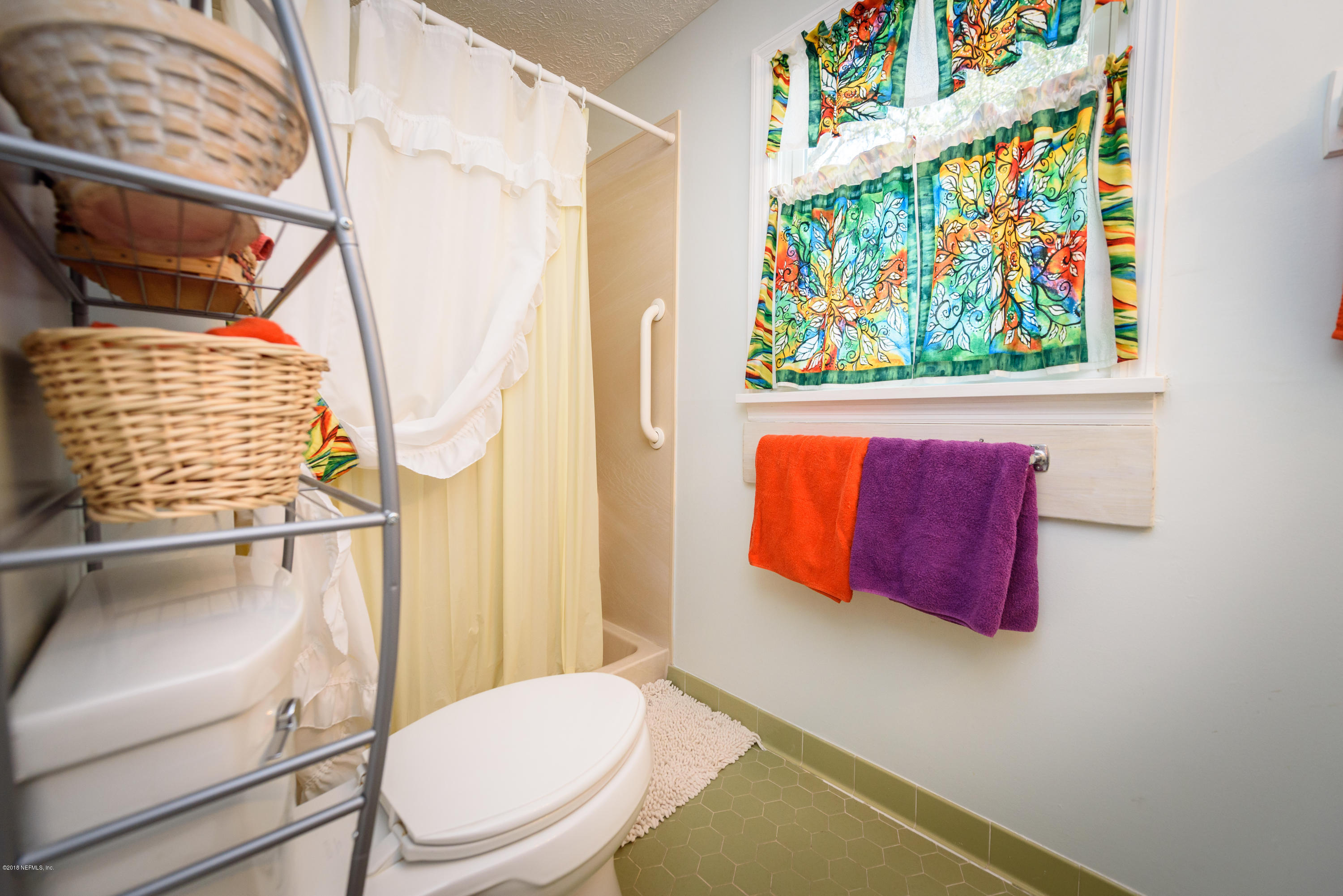 249 Bonita Road St. Augustine, FL 32086 - Photo 33 of 46 a bathroom with a toilet and a shower curtain