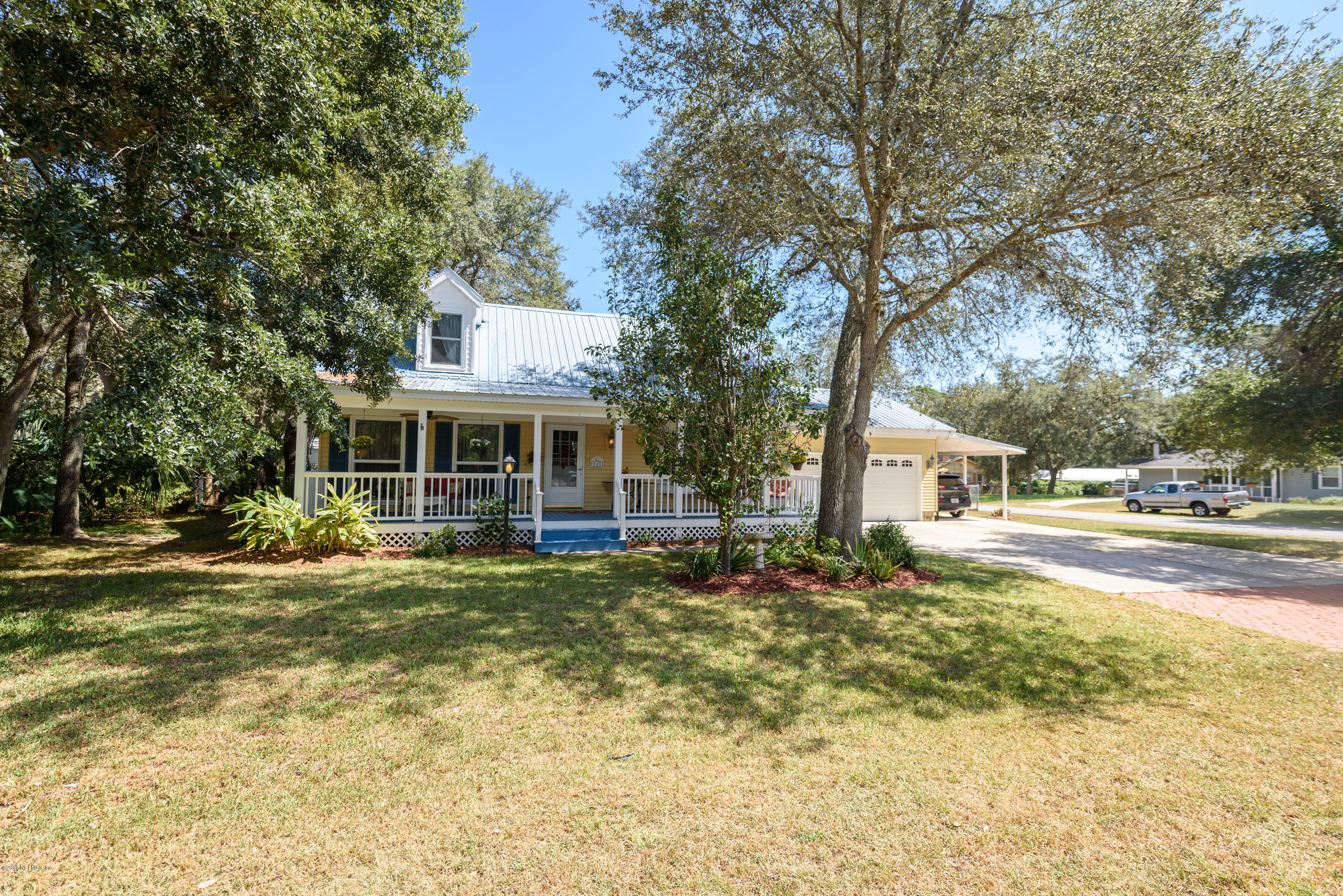 249 Bonita Road St. Augustine, FL 32086 - Photo 4 of 46 a front view of a house with swimming pool and furniture