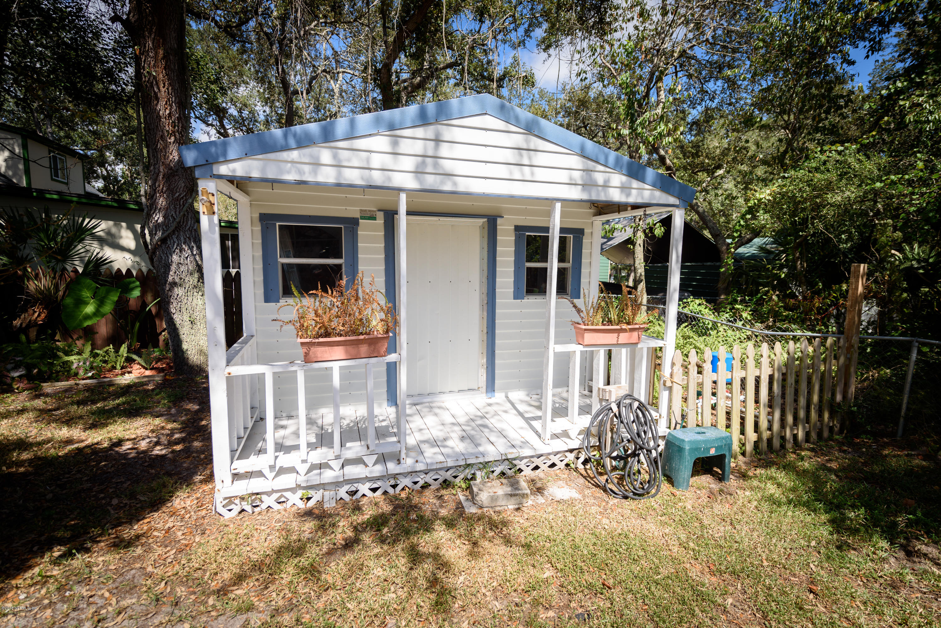 249 Bonita Road St. Augustine, FL 32086 - Photo 42 of 46 a view of a house with a yard porch and furniture