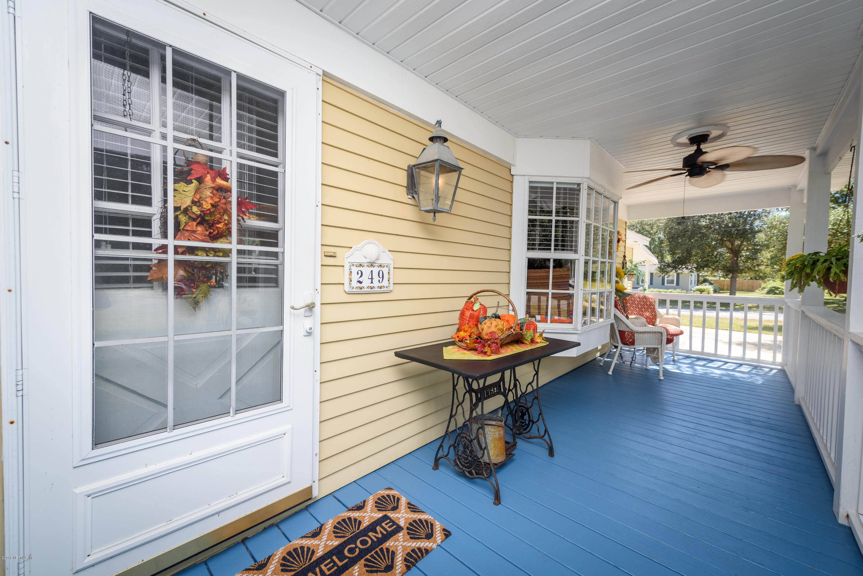 249 Bonita Road St. Augustine, FL 32086 - Photo 8 of 46 a view of a deck with wooden floor and a table