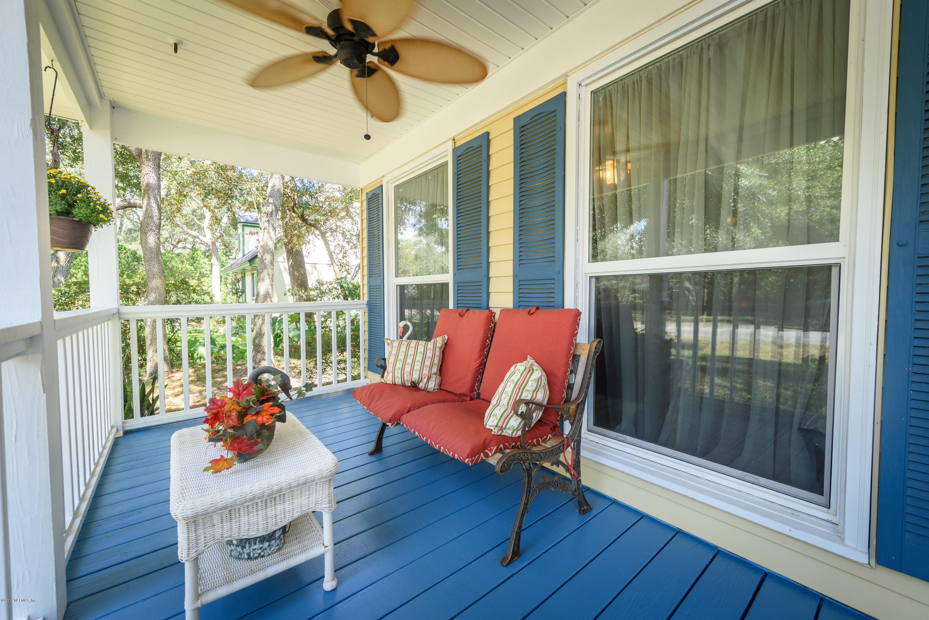 249 Bonita Road St. Augustine, FL 32086 - Photo 10 of 46 a living room with furniture and a floor to ceiling window