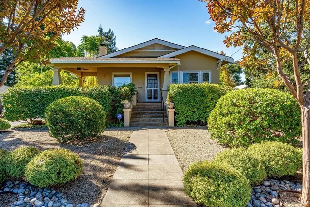 a front view of a house with garden