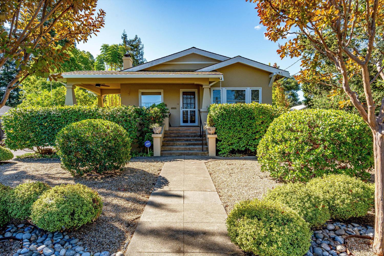 a front view of a house with garden