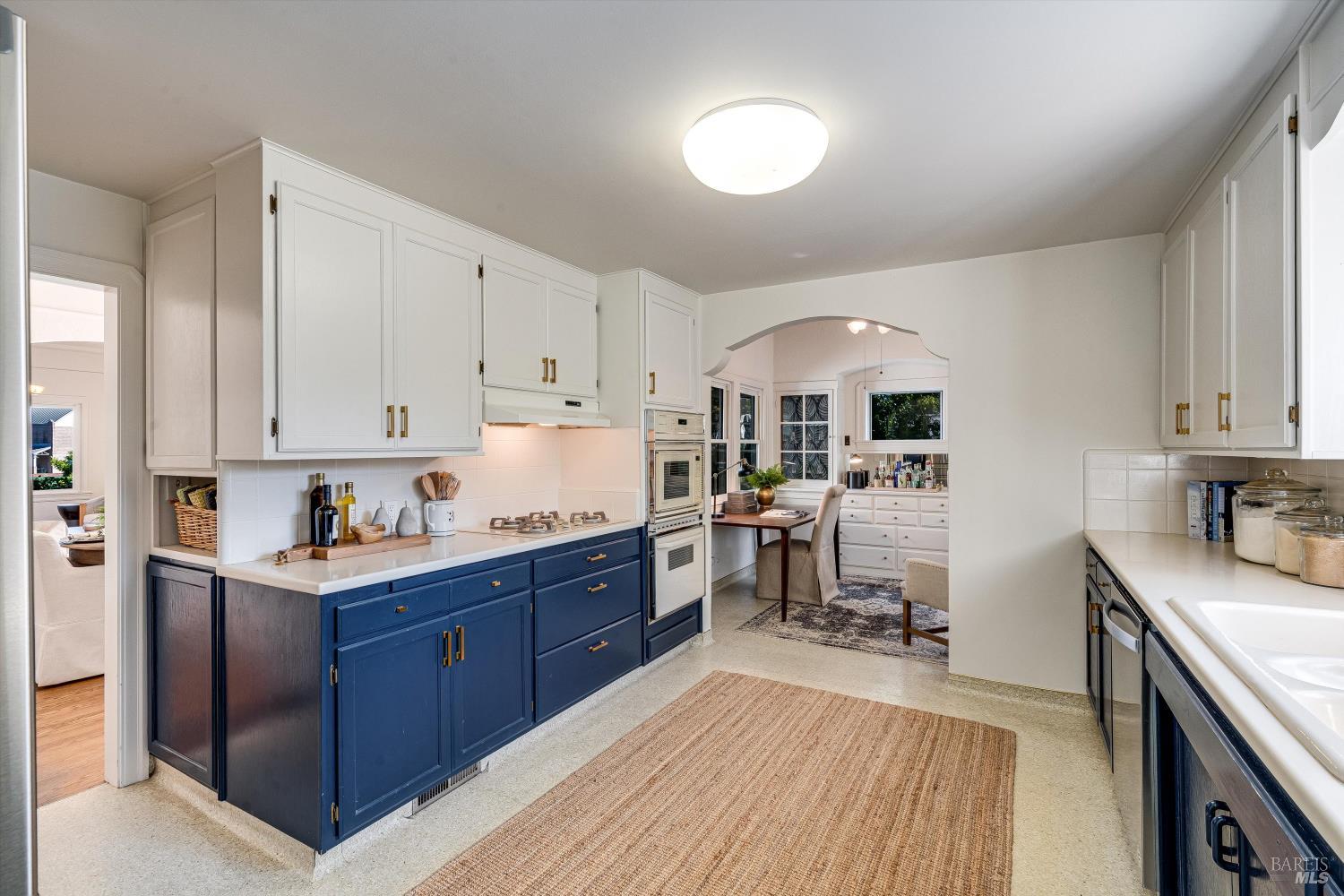 1709 Spring Mountain Road St. Helena, CA 94574 - Photo 17 of 48 a kitchen with granite countertop a sink stove and cabinets
