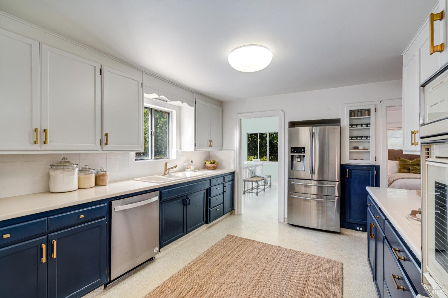 1709 Spring Mountain Road St. Helena, CA 94574 - Photo 19 of 48 a kitchen with stainless steel appliances granite countertop a refrigerator and a stove top oven