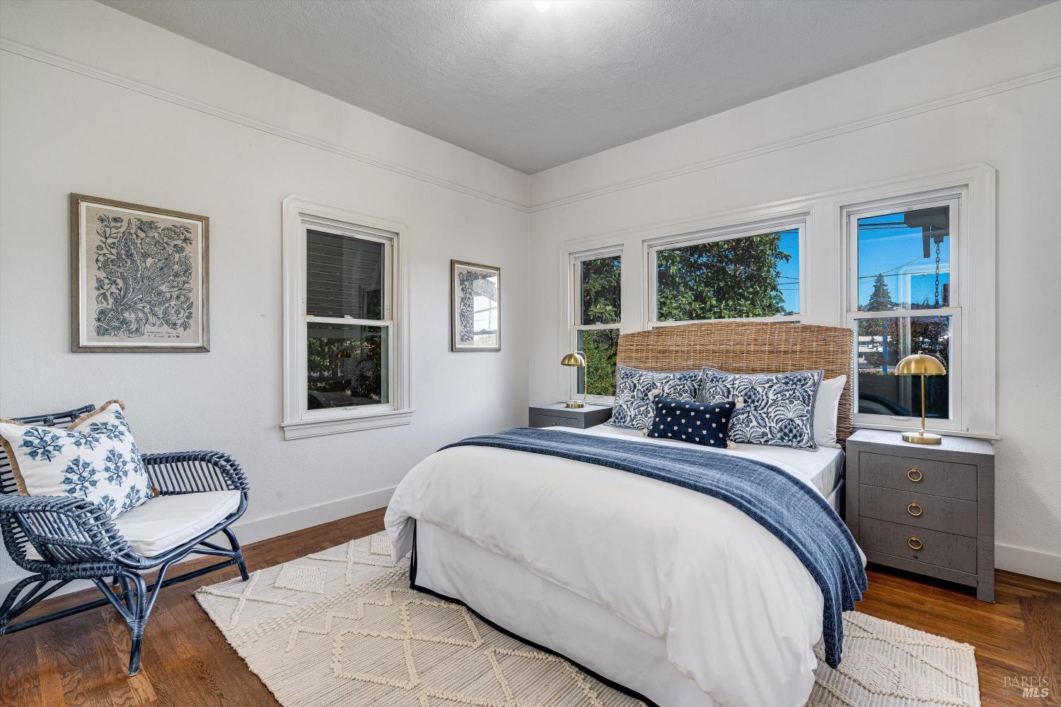 1709 Spring Mountain Road St. Helena, CA 94574 - Photo 22 of 48 a bedroom with a bed and wooden floor