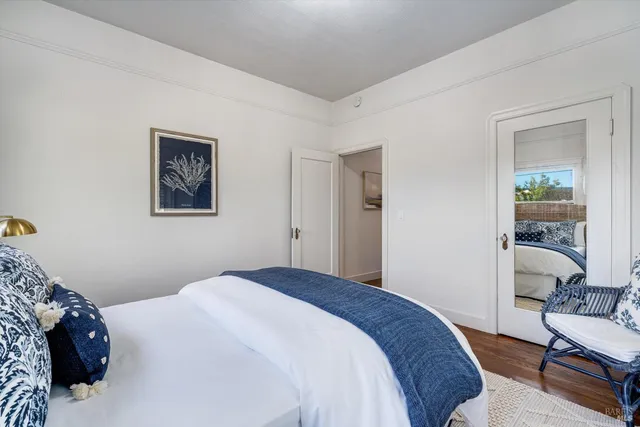 a bedroom with a bed and a couch