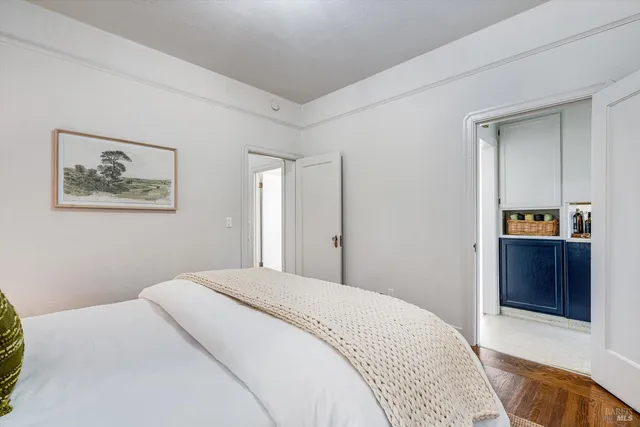 a bedroom with a bed and a dresser