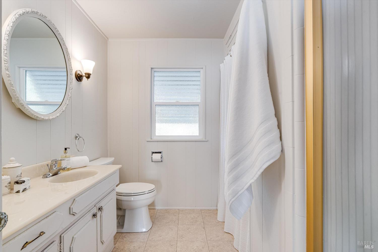 1709 Spring Mountain Road St. Helena, CA 94574 - Photo 28 of 48 a bathroom with a toilet sink and mirror