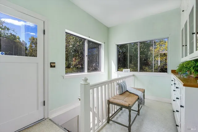 a view of a two chairs in the balcony