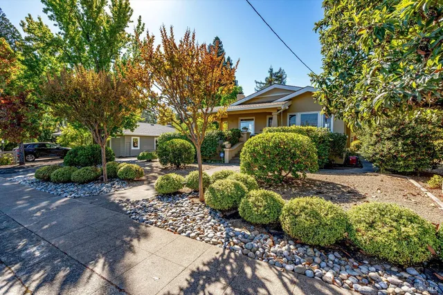 a front view of a house with garden