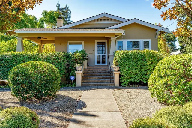 a view of a chairs and table in the patio