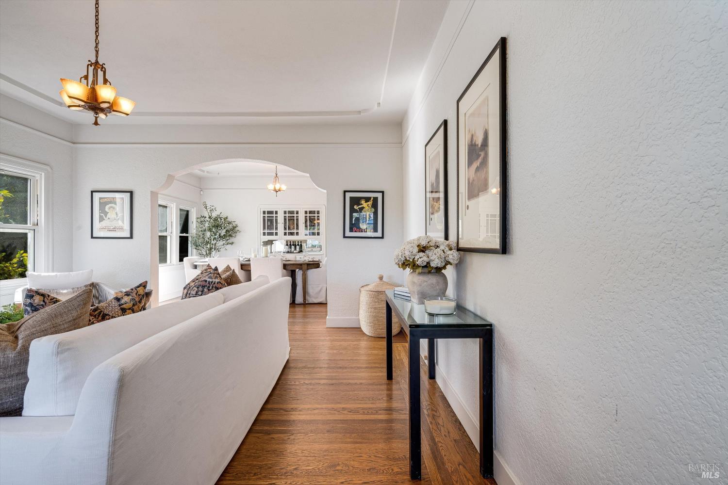 1709 Spring Mountain Road St. Helena, CA 94574 - Photo 9 of 48 a living room with furniture and a chandelier