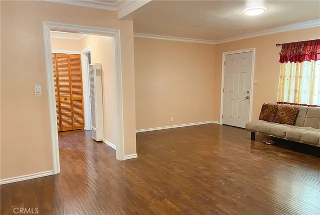 a view of a livingroom with furniture and wooden floor