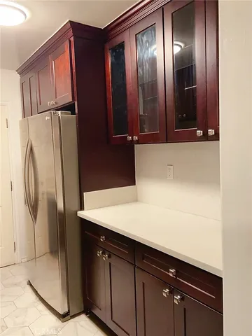 a kitchen with a refrigerator and countertop