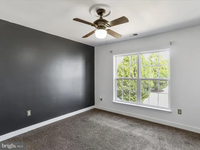 a bathroom with a sink a toilet mirror and vanity