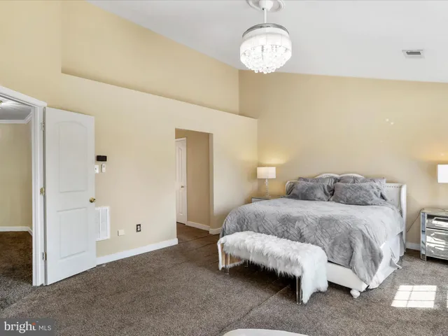a view of a hallway view with wooden floor and staircase