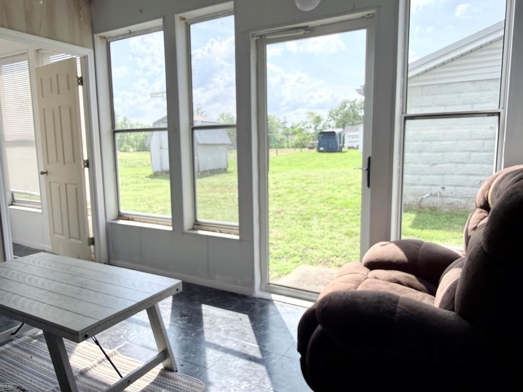 137 Dripping Springs Street Crofton, KY 42217 - Photo 20 of 51 a living room with furniture and a floor to ceiling window