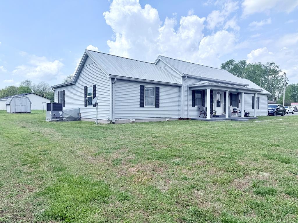 137 Dripping Springs Street Crofton, KY 42217 - Photo 42 of 51 a view of a house with a yard and sitting area