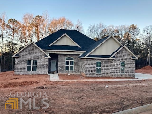 123 Timber Ridge Circle Byron, GA 31008 - Photo 1 of 1 a front view of a house with yard and trees