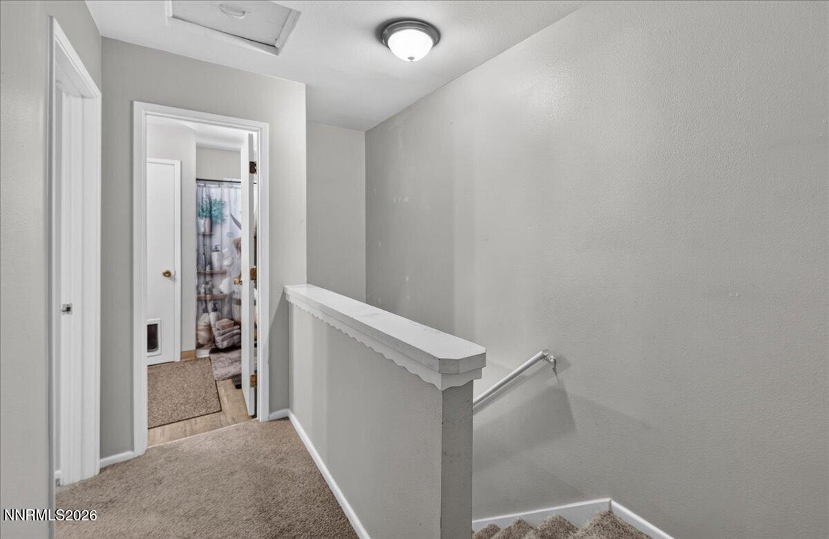 5 Smithridge Park Reno, NV 89502 - Photo 13 of 24 a view of a hallway with closet and livingroom view