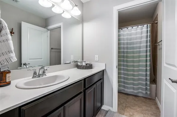a bathroom with a sink a vanity and a mirror