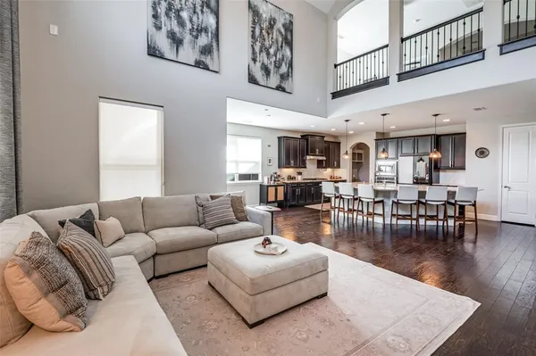 a living room with furniture and kitchen view