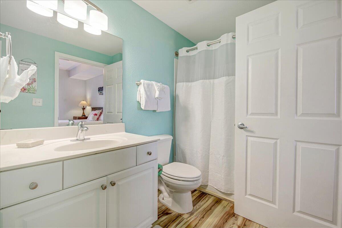 16819 Front Beach Road, Unit 2210 Panama City Beach, FL 32413 - Photo 11 of 30 a bathroom with a sink toilet and shower