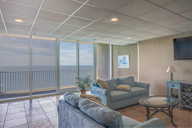 16819 Front Beach Road, Unit 2210 Panama City Beach, FL 32413 - Photo 26 of 30 a living room with furniture and a flat screen tv