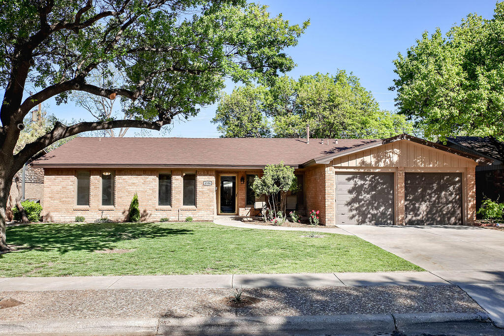 4106 64th Street Lubbock, TX 79413 - Photo 2 of 60 front view of a house with a yard