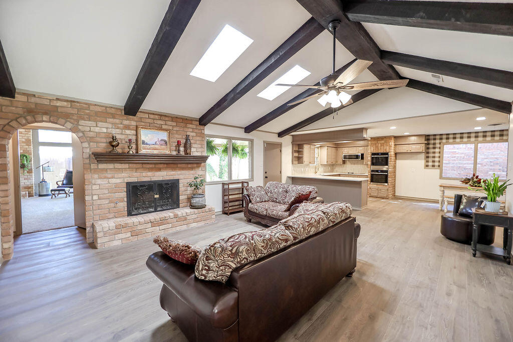 4106 64th Street Lubbock, TX 79413 - Photo 22 of 60 a living room with furniture and a fireplace
