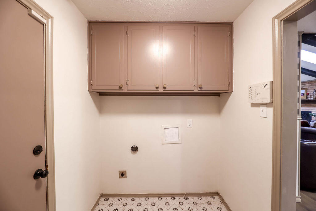 4106 64th Street Lubbock, TX 79413 - Photo 29 of 60 a view of a closet area with wooden floor