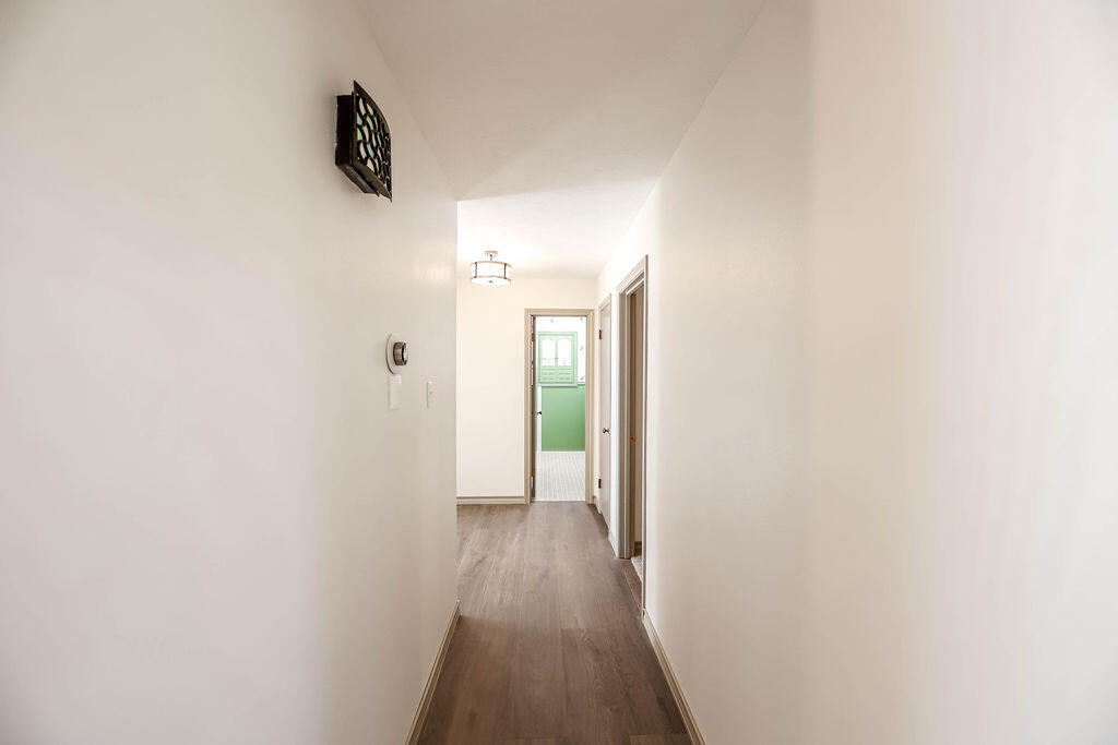 4106 64th Street Lubbock, TX 79413 - Photo 30 of 60 a view of a hallway with wooden floor
