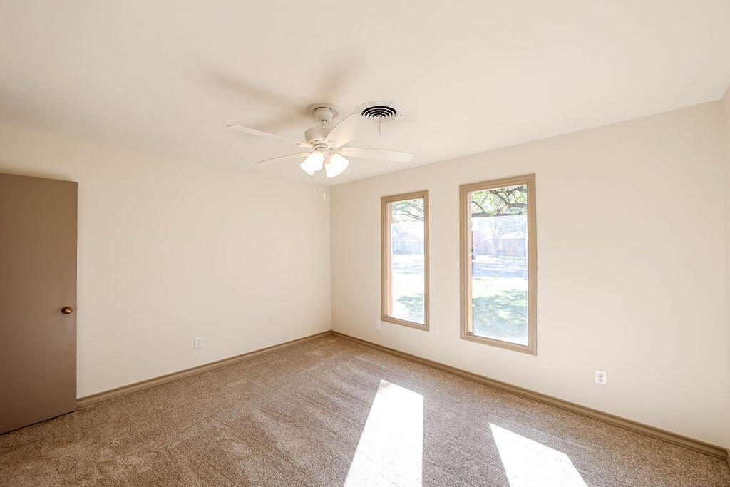 4106 64th Street Lubbock, TX 79413 - Photo 35 of 60 an empty room with windows and closet