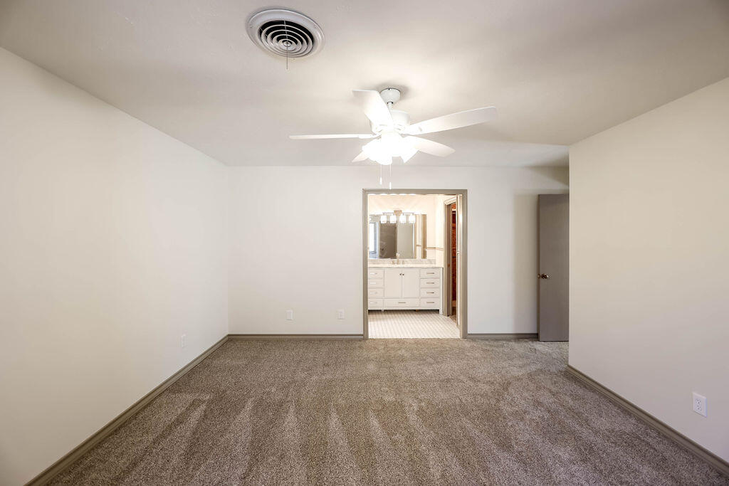 4106 64th Street Lubbock, TX 79413 - Photo 42 of 60 an empty room with a empty space and a ceiling fan