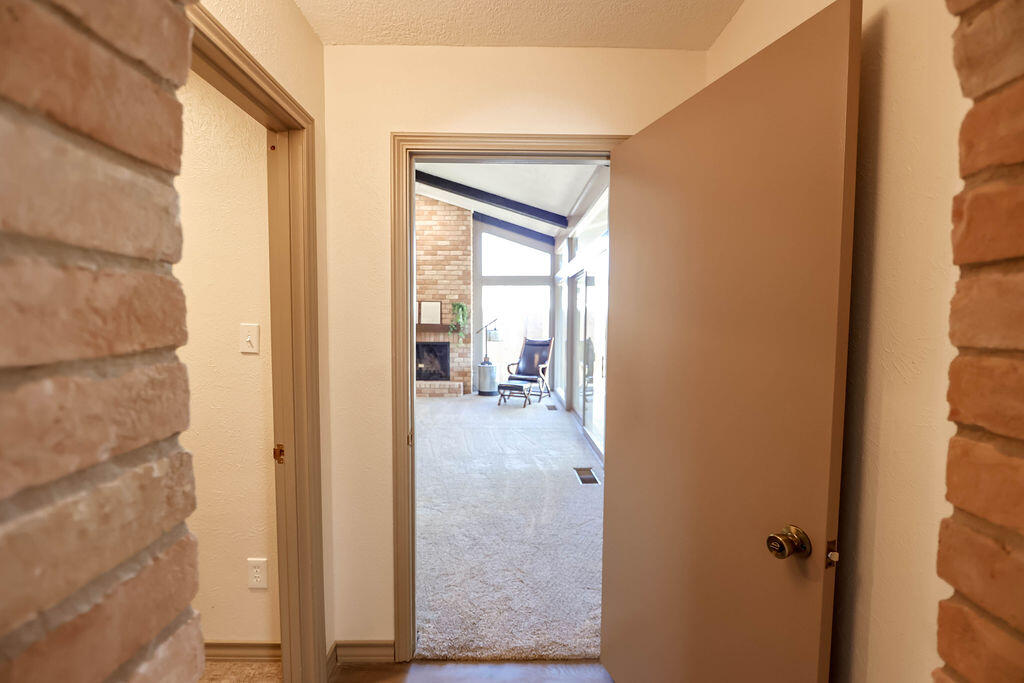 4106 64th Street Lubbock, TX 79413 - Photo 47 of 60 a view of a bathroom from a hallway