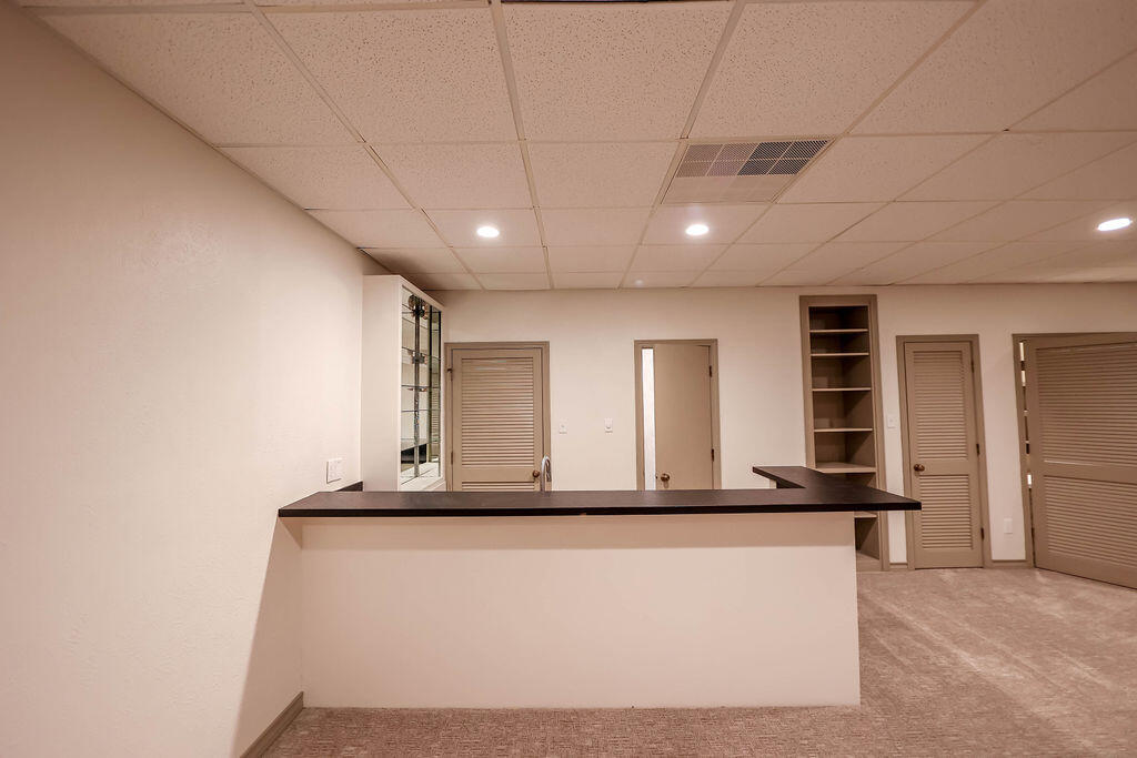 4106 64th Street Lubbock, TX 79413 - Photo 51 of 60 a view of a hallway with workspace