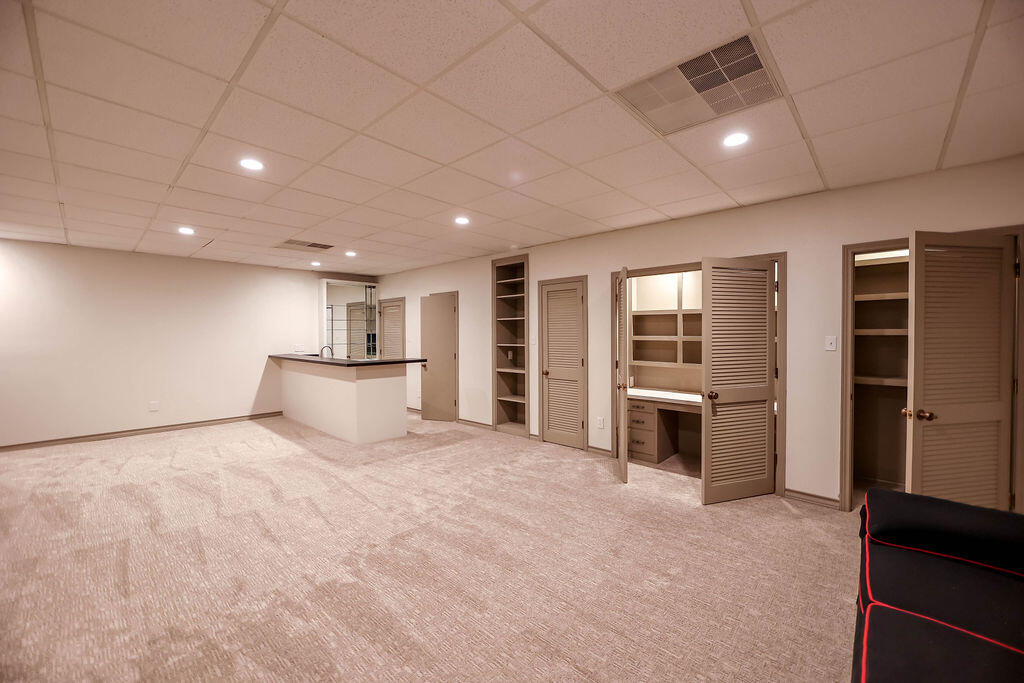 4106 64th Street Lubbock, TX 79413 - Photo 54 of 60 a view of an empty room with a window and kitchen