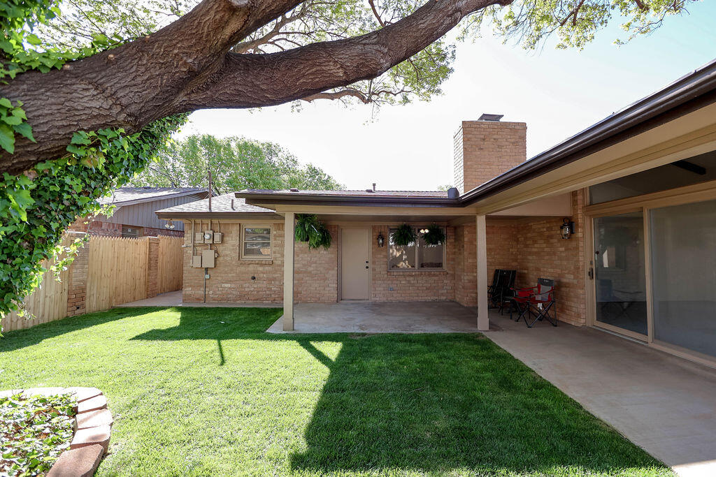 4106 64th Street Lubbock, TX 79413 - Photo 60 of 60 a front view of a house with a garden and plants