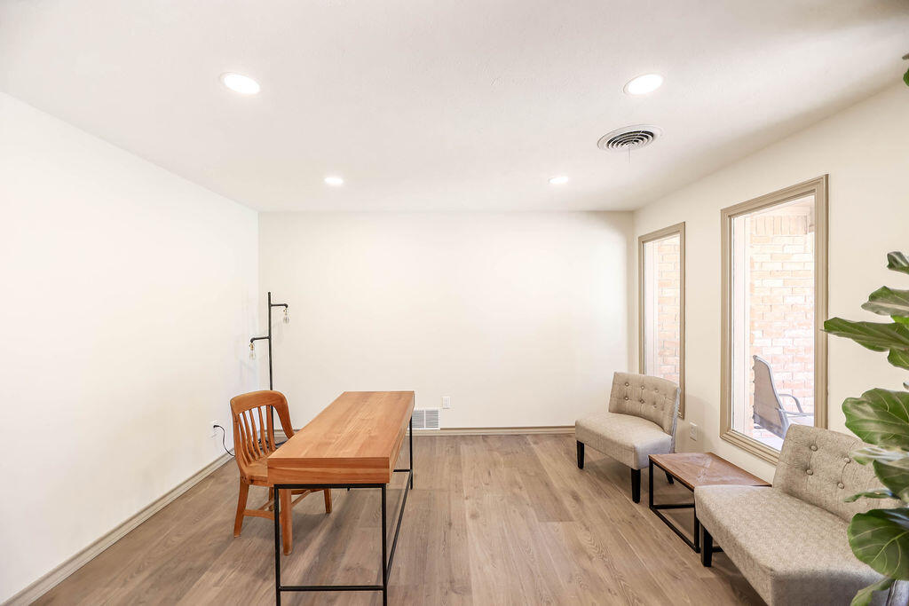 4106 64th Street Lubbock, TX 79413 - Photo 6 of 60 a view of a room with furniture and wooden floor