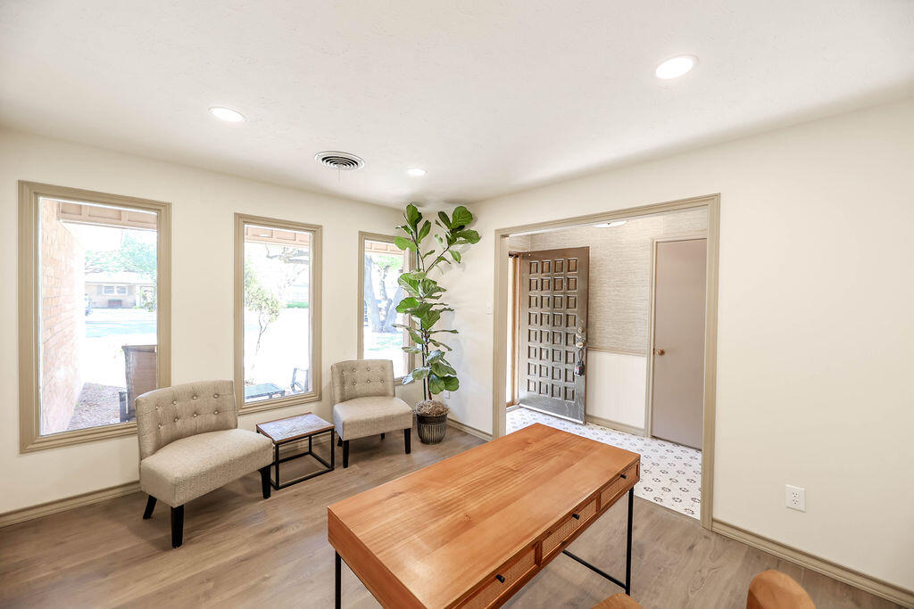 4106 64th Street Lubbock, TX 79413 - Photo 7 of 60 a living room with furniture and a potted plant
