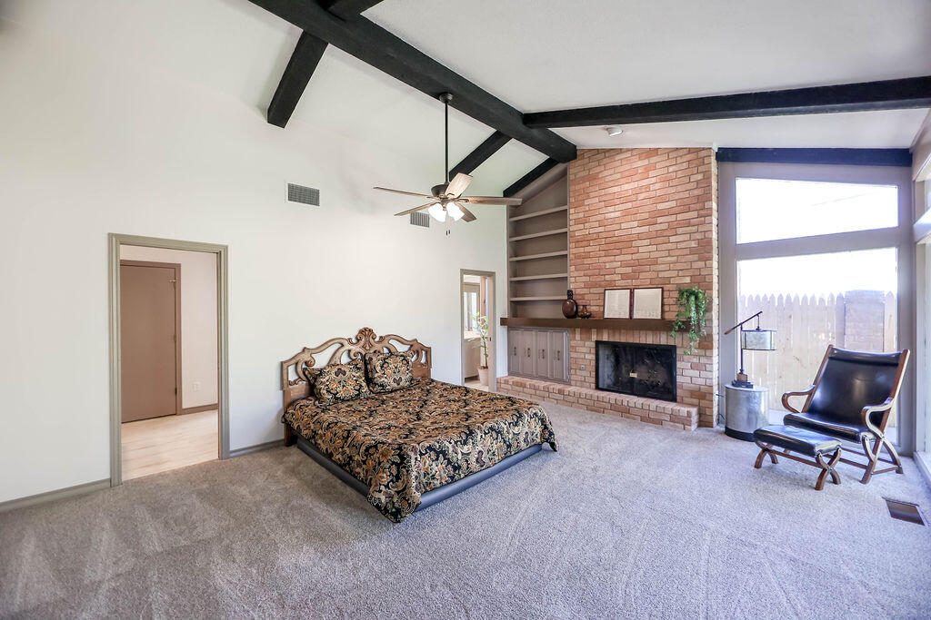 4106 64th Street Lubbock, TX 79413 - Photo 10 of 60 a living room with furniture and a fireplace