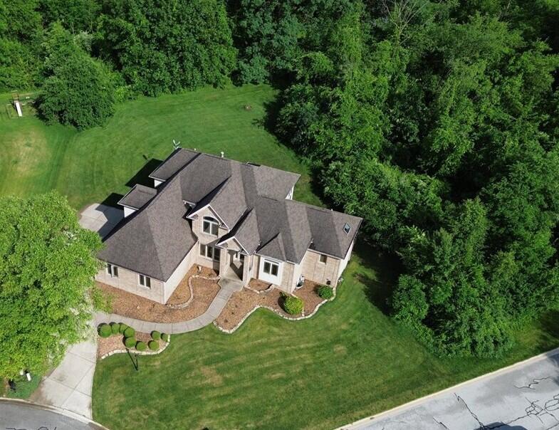 8751 Bridgewater Court Crown Point, IN 46307 - Photo 12 of 49 an aerial view of a house with a garden