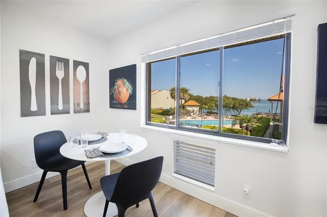 a view of a dining room with furniture window and outside view