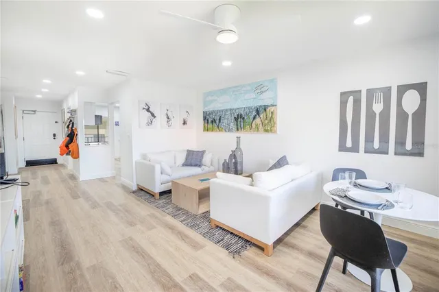 a living room with furniture and a table